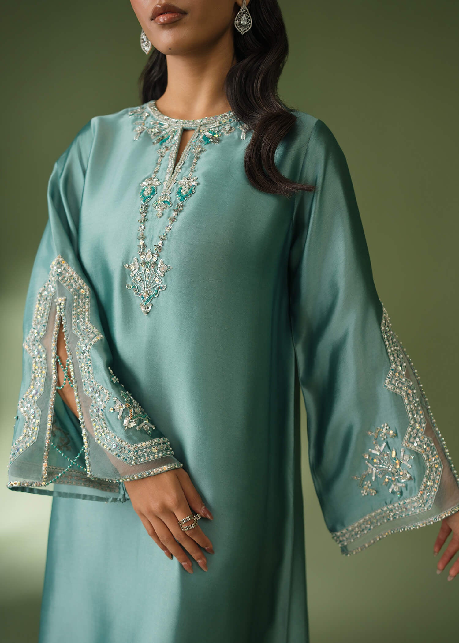 Teal silk suit with floor-length shirt and sequin embroidery