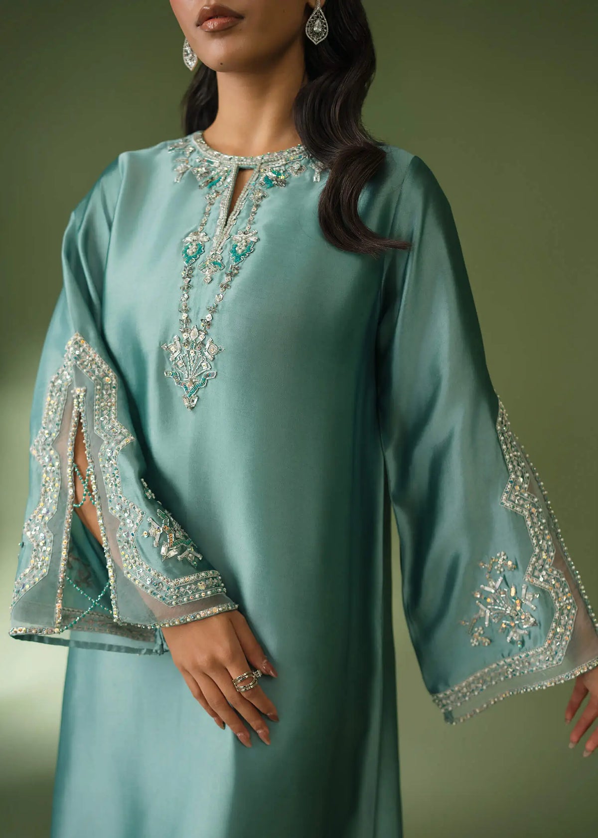 Teal silk suit with floor-length shirt and sequin embroidery