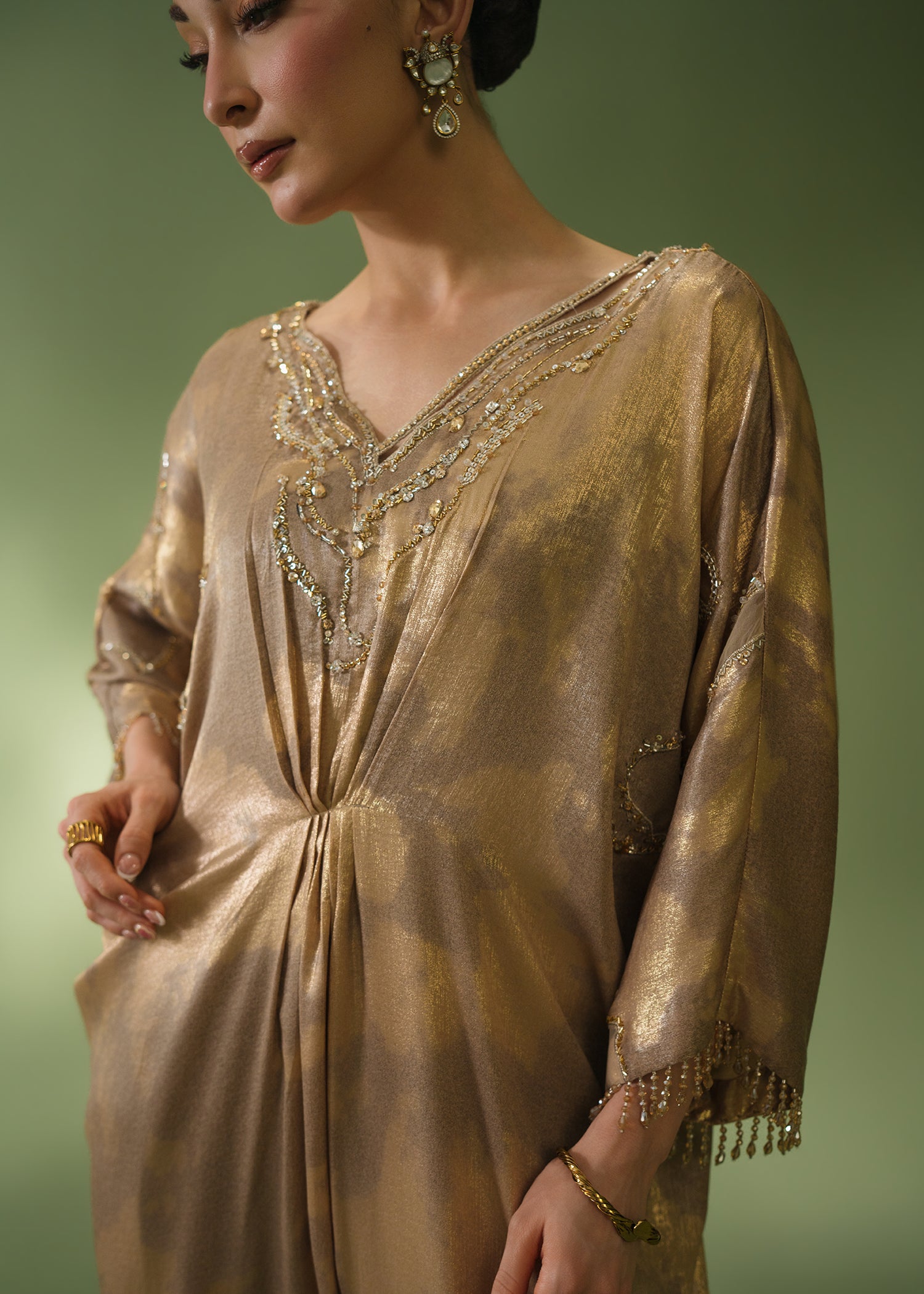 Gold tie-dye kaftan with beaded neckline and sequin hem