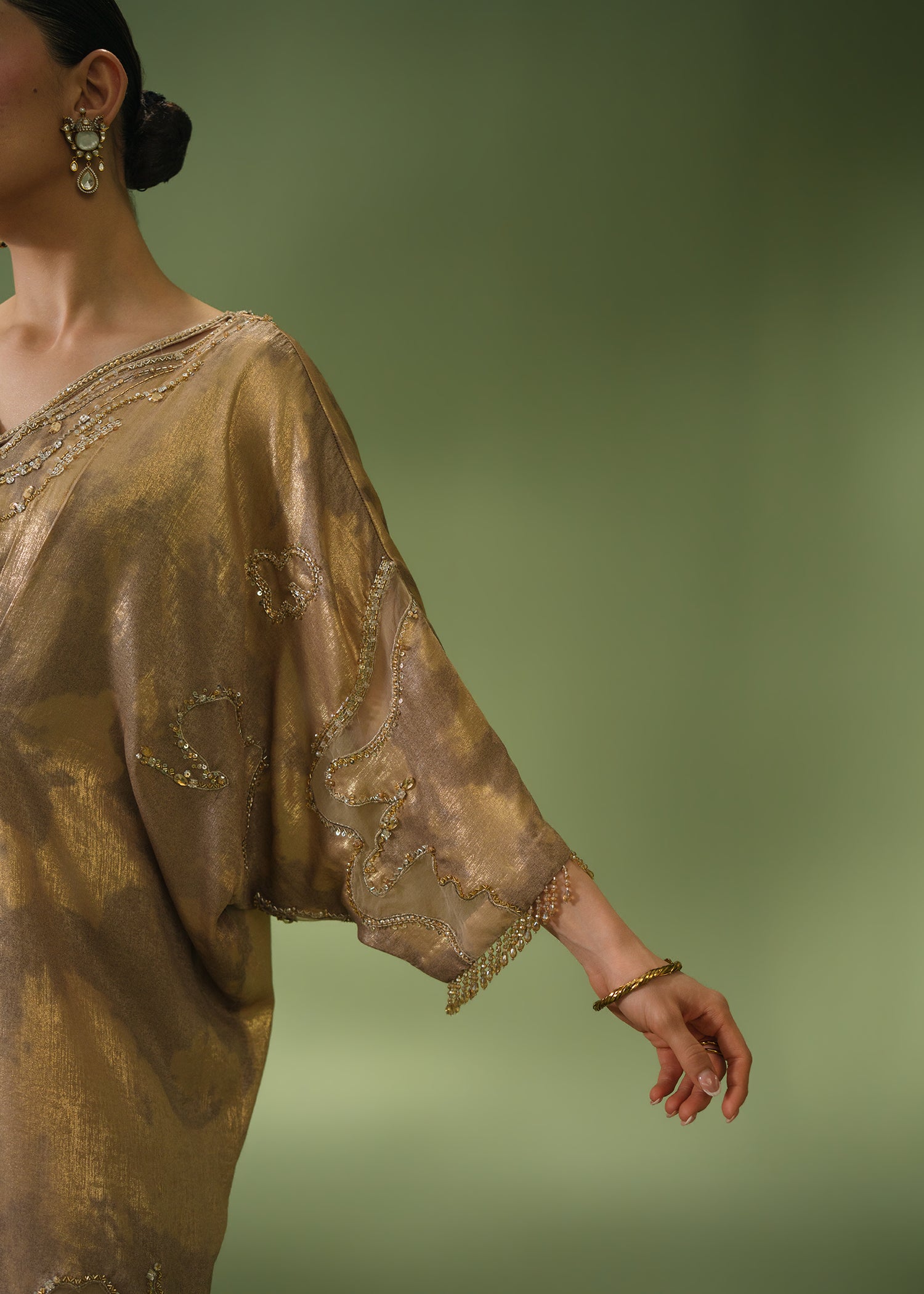 Gold tie-dye kaftan with beaded neckline and sequin hem