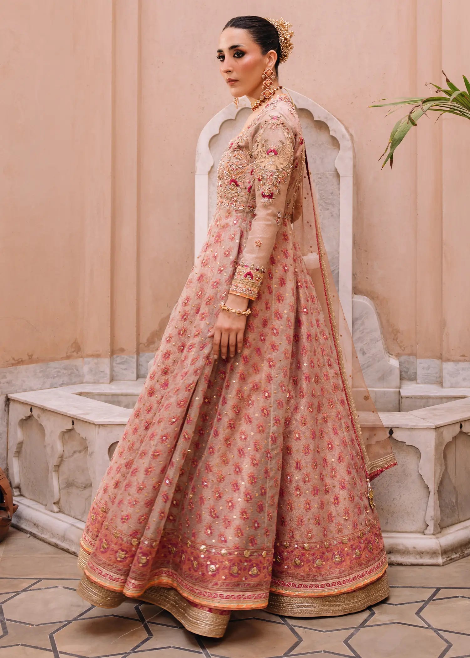 Orchid Pink ivory khaddi net kalidar with artisanal block-printed panels and a rich jamawar lehnga for a traditional Pakistani formal look.