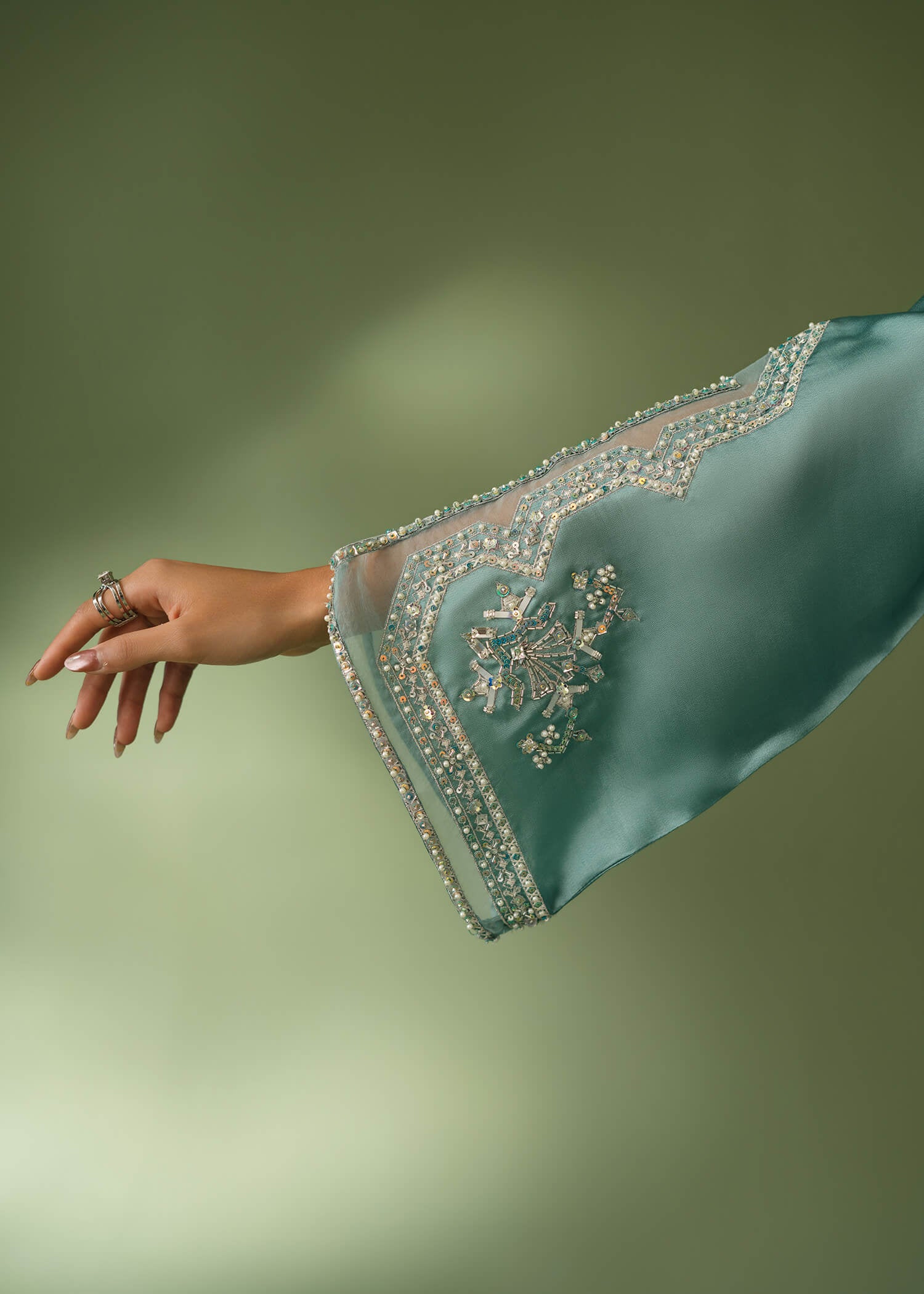 Teal silk suit with floor-length shirt and sequin embroidery
