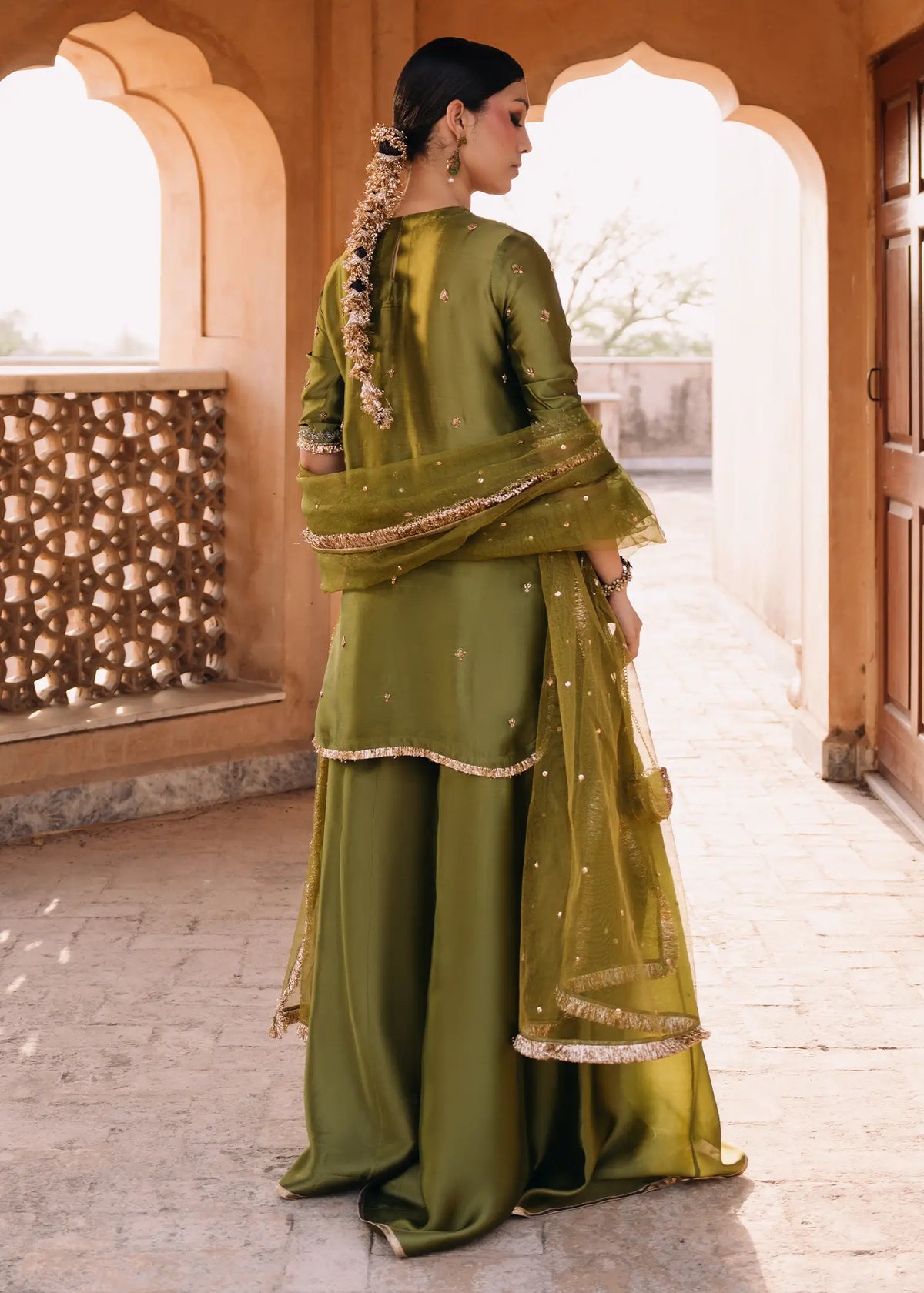 JEEM Olive Tree peacock green sheesha silk suit with zardozi resham work
