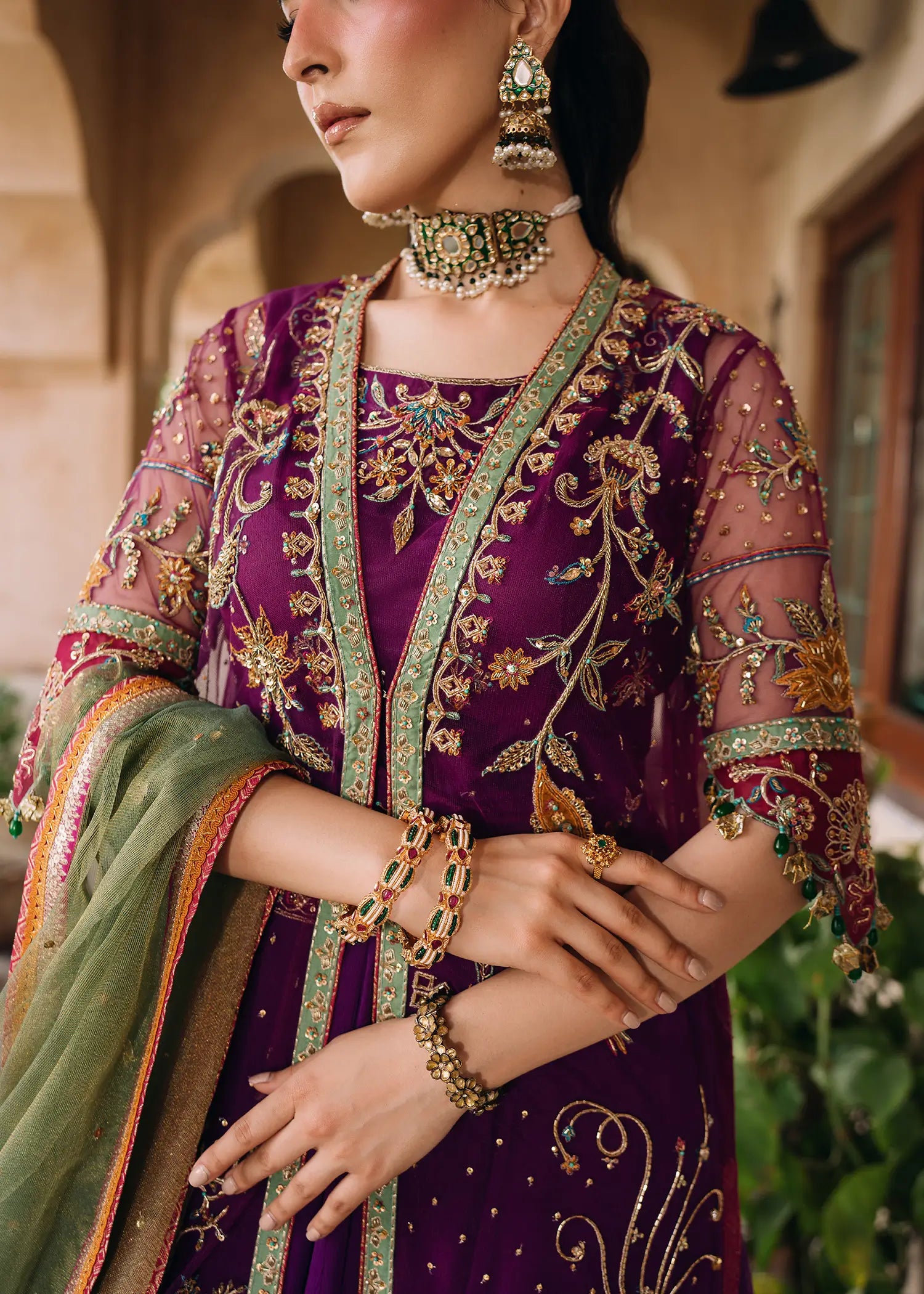 Magenta Zareen luxury net jacket with resham and zardozi embroidery paired with a flowing chiffon lehnga and khaddi net dupatta.
