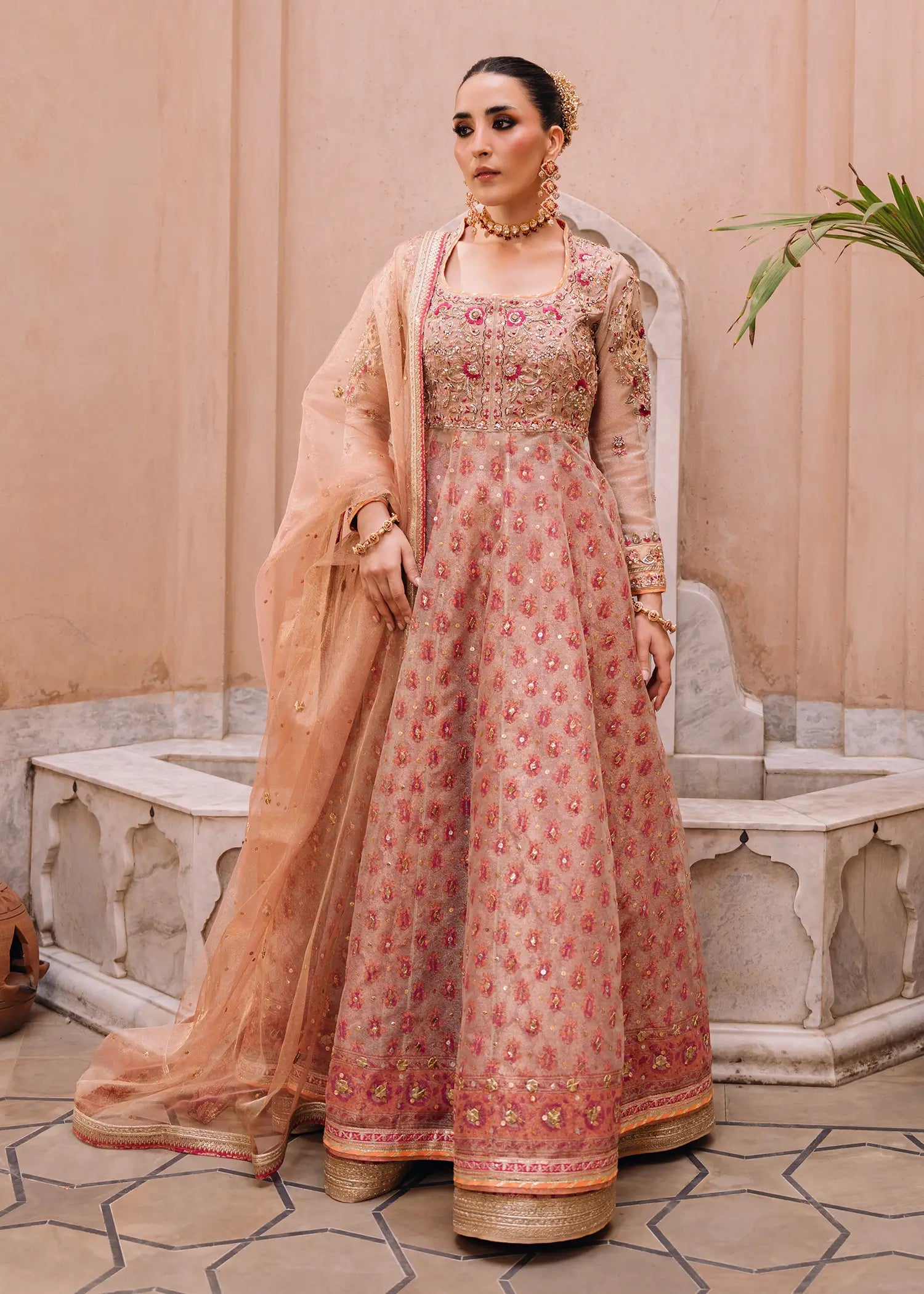 Orchid Pink ivory khaddi net kalidar with artisanal block-printed panels and a rich jamawar lehnga for a traditional Pakistani formal look.
