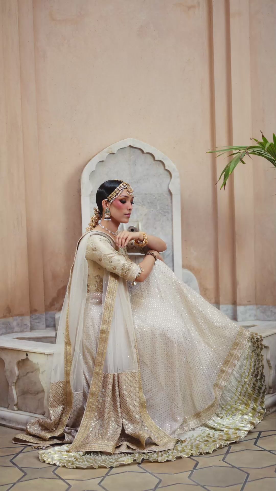 Sitara Kalidar ivory luxury formal dress with delicate cutwork, zardozi embroidery, and traditional block print panels for a timeless appeal.
