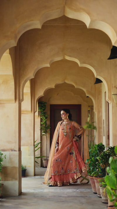 Persian Night soft peach khaddi net shirt with luxury zardozi work and velvet patchwork layered over a crushed inner kalidaar.
