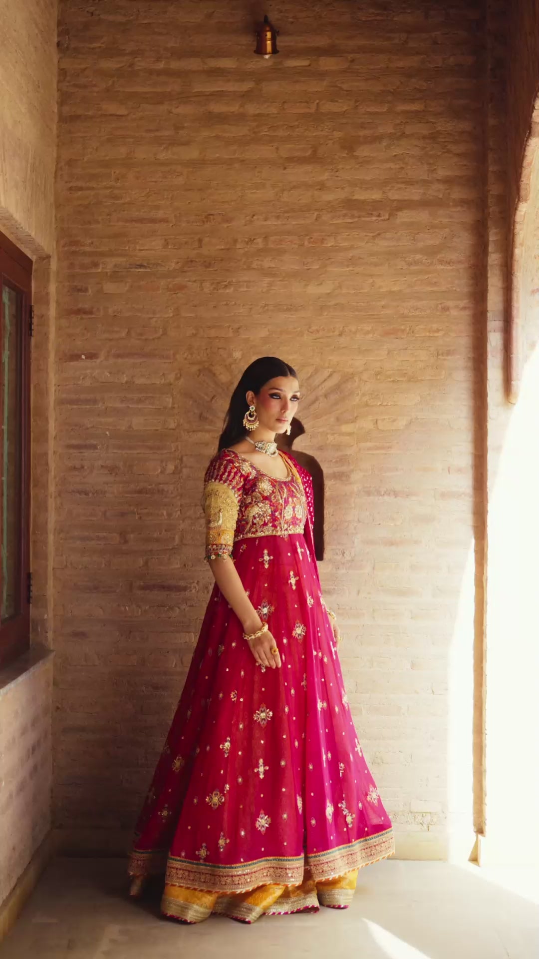 Fuschia Naaz radiant tussel silk silhouette in deep pink with mukesh net dupatta and detailed zardozi hand-embellishments.
